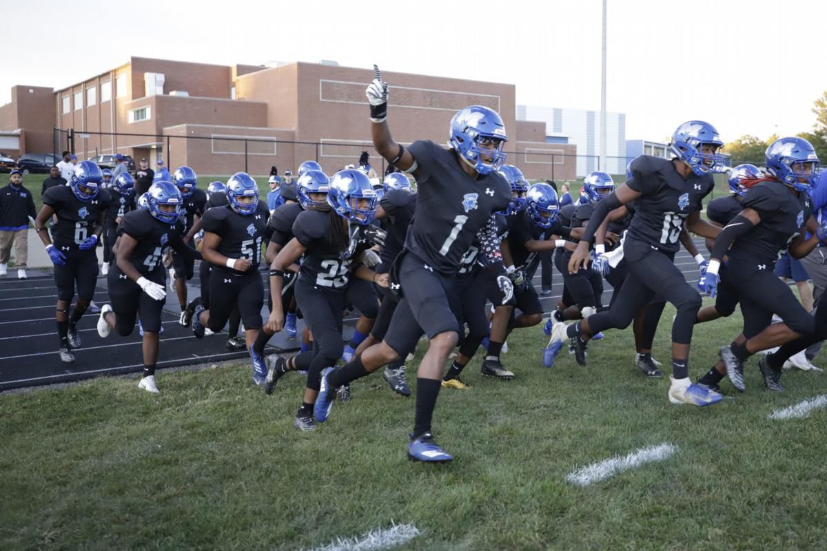 MacArthur's Jeffery Wells and Malachi Thomas push the Generals' defense